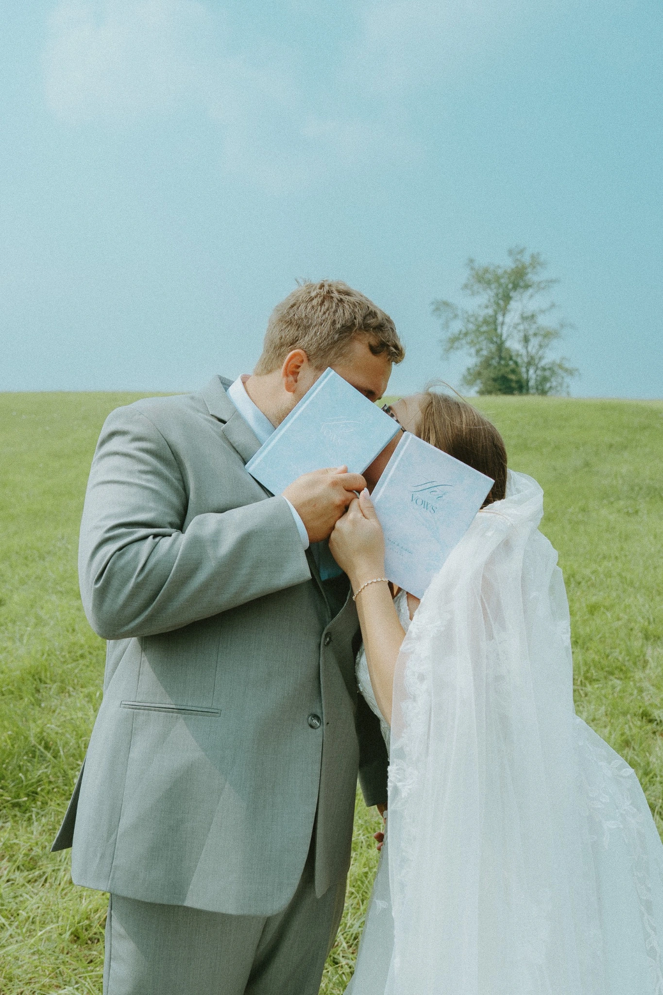A soft, nostalgic wedding portrait made with vow books